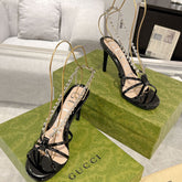 STRAPPY SANDAL WITH RHINESTONE CHAIN IN BLACK PATENT LEATHER